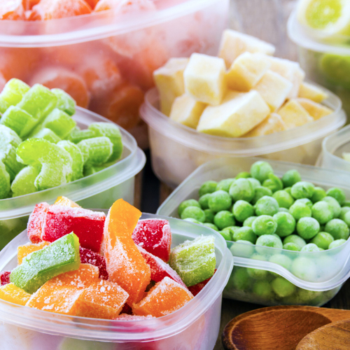 Frozen fruit and vegetables in plastic containers 