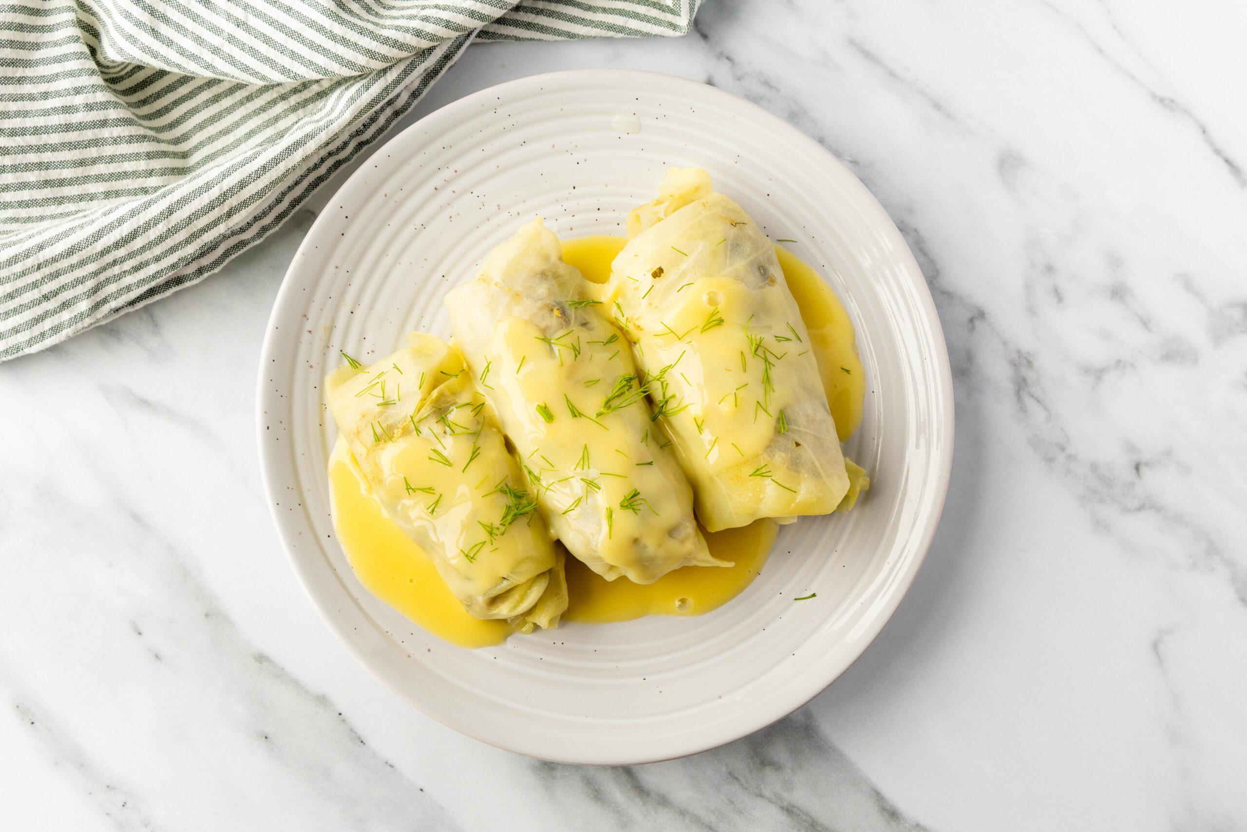 Greek Stuffed Cabbage Rolls with Avgolemono Sauce (Lahanodolmades) - Community Natural Foods