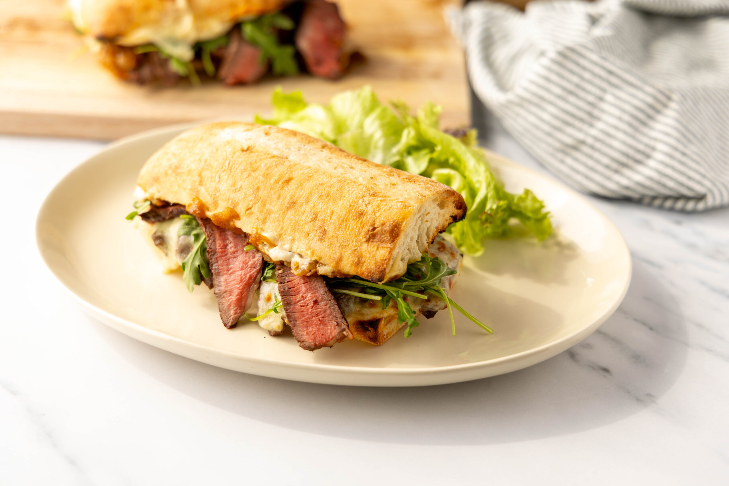 Grilled Steak Sandwich with Caramelized Onions, Roasted Garlic Mayo - Community Natural Foods